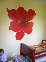 mural of a large flower on the wall